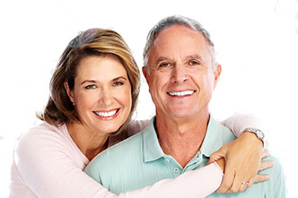older man and woman smiling
